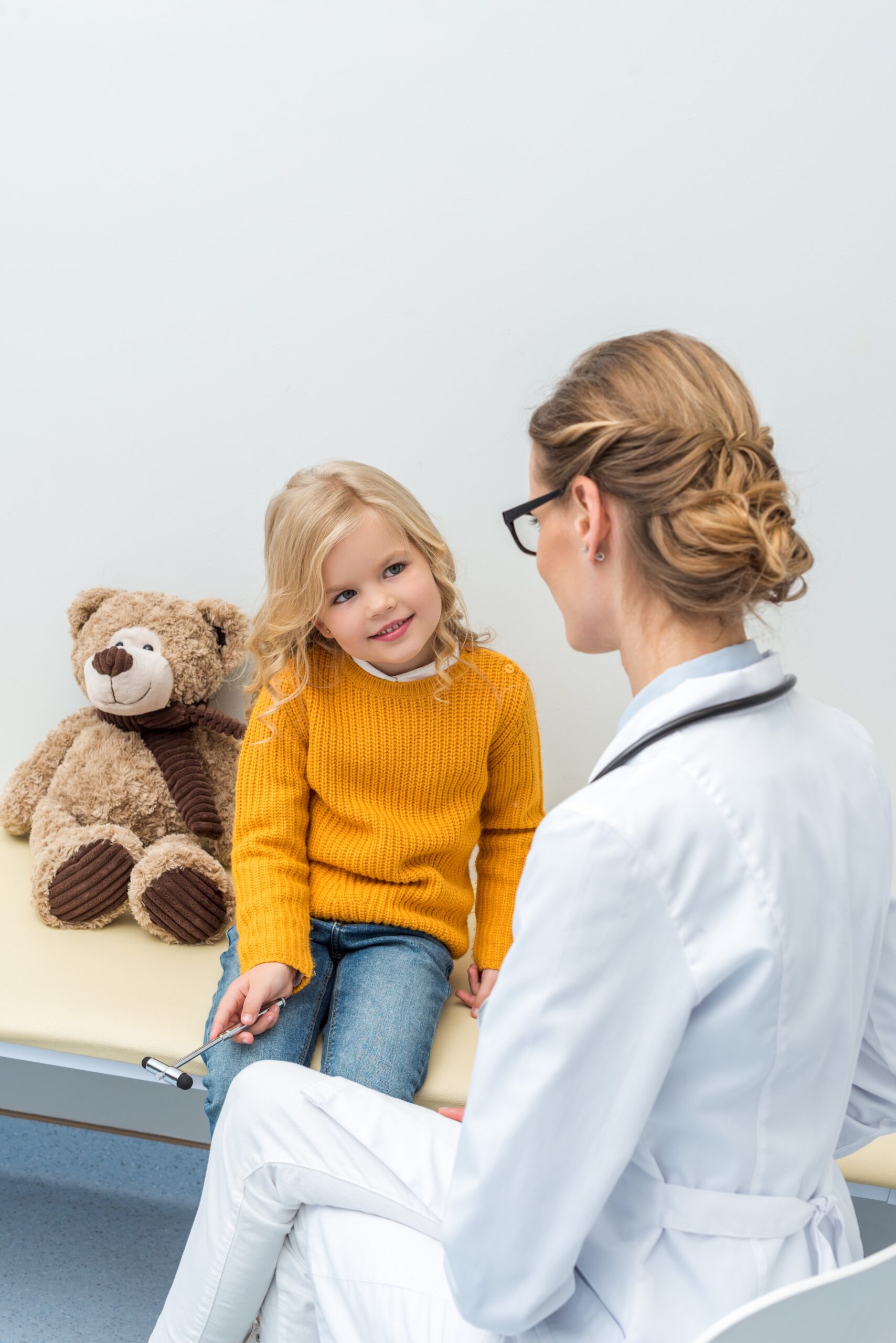 Young girl visits pediatrician